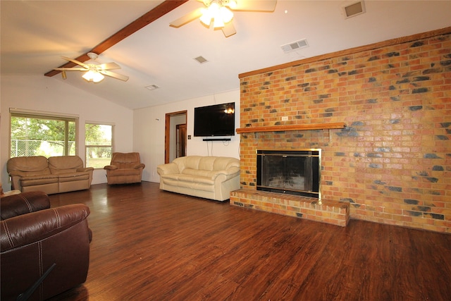 living room featuring a brick fireplace, ceiling fan, dark hardwood / wood-style flooring, and vaulted ceiling with beams