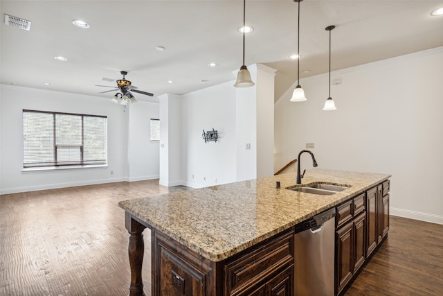 kitchen with a kitchen island with sink, dishwasher, sink, light stone countertops, and dark wood-type flooring