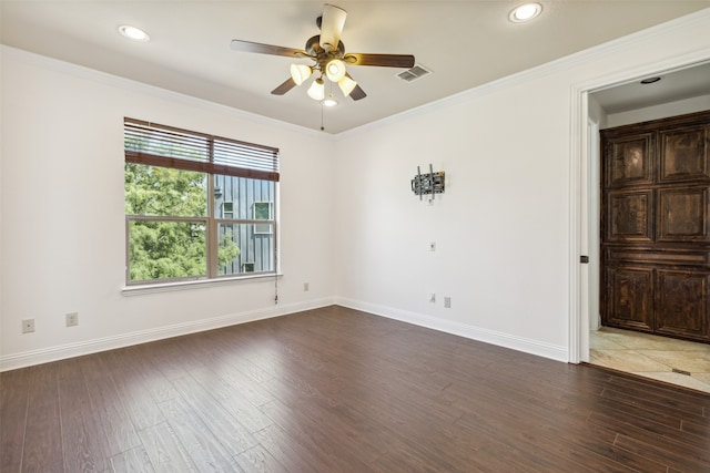 spare room featuring crown molding, ceiling fan, and hardwood / wood-style flooring