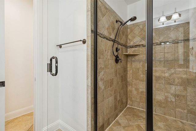 bathroom with a shower with shower door