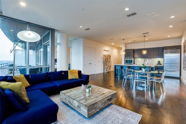 living room with dark hardwood / wood-style flooring