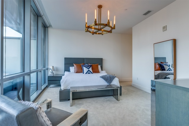 carpeted bedroom with a chandelier