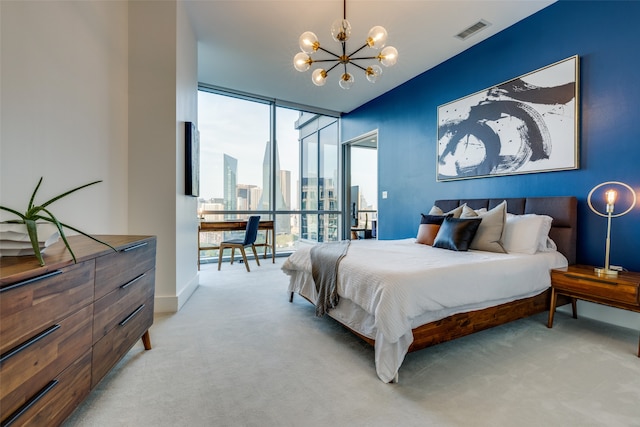 carpeted bedroom with expansive windows and a notable chandelier