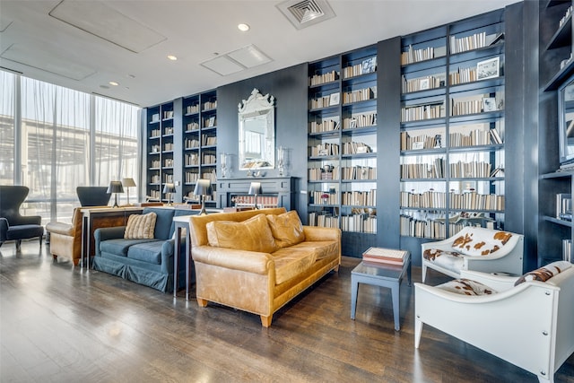 sitting room featuring hardwood / wood-style flooring and floor to ceiling windows