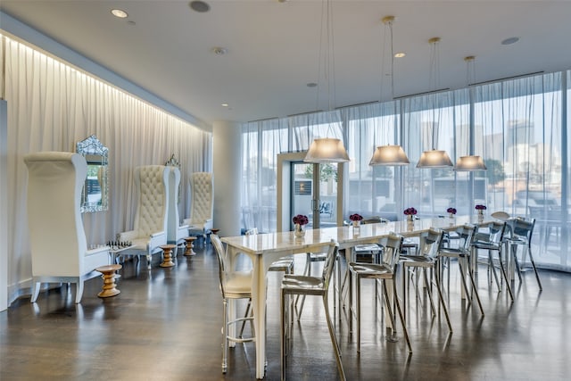 kitchen featuring a breakfast bar, a center island, and decorative light fixtures