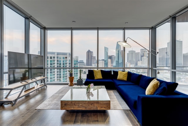 living room with wood-type flooring and floor to ceiling windows