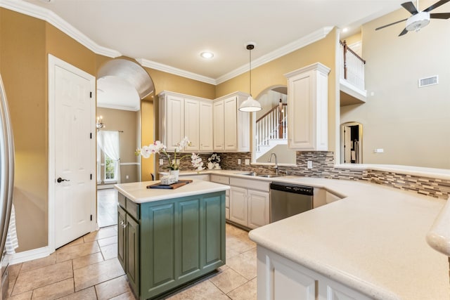 kitchen featuring white cabinetry, a kitchen island, green cabinetry, dishwasher, and ceiling fan