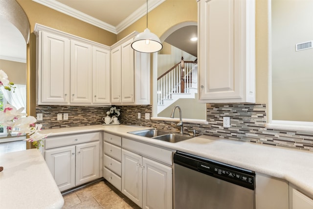 kitchen with pendant lighting, white cabinets, dishwasher, and sink