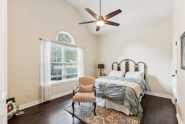 bedroom with ceiling fan, dark hardwood / wood-style flooring, and multiple windows