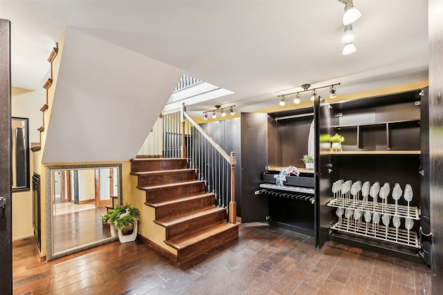 stairs with hardwood / wood-style floors