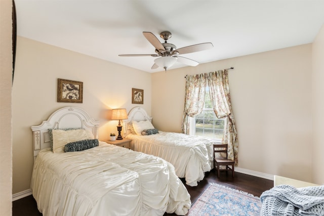 bedroom featuring dark wood-type flooring and ceiling fan