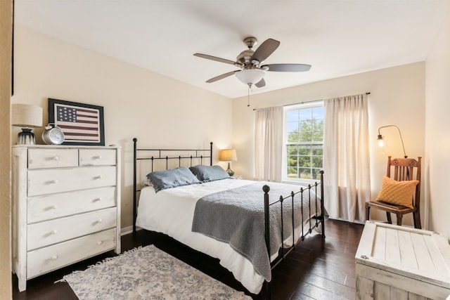 bedroom with ceiling fan and dark hardwood / wood-style floors