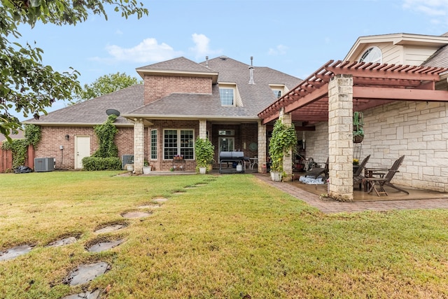 rear view of property featuring a pergola, central AC, a patio area, and a yard