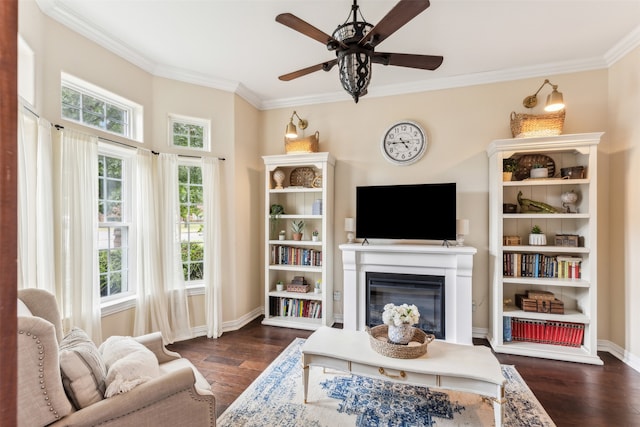 living room with ceiling fan, dark hardwood / wood-style floors, and crown molding