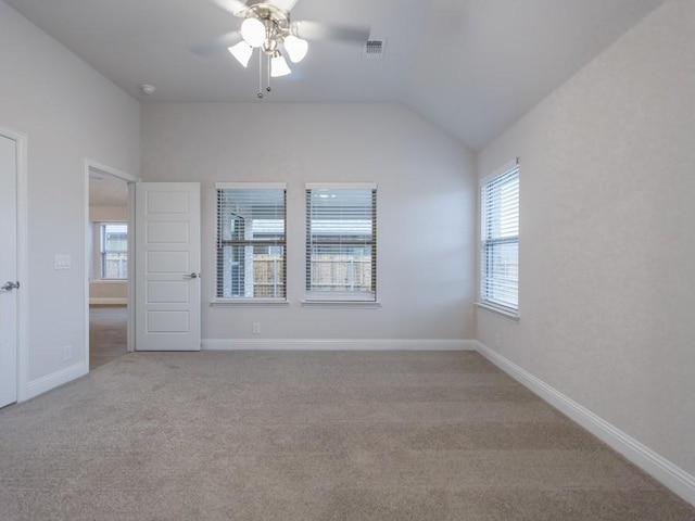 spare room with light carpet, ceiling fan, and lofted ceiling