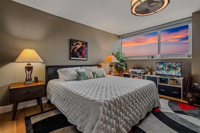 bedroom with hardwood / wood-style floors