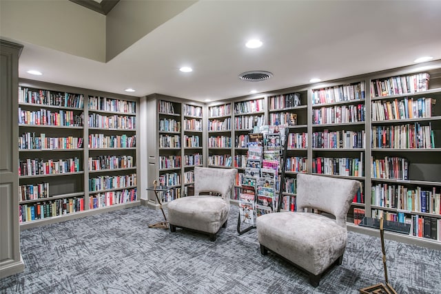 sitting room with carpet floors