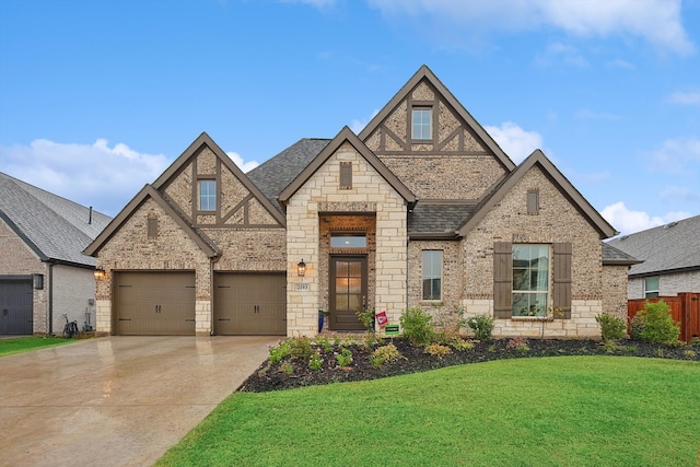 view of front facade featuring a garage and a front lawn