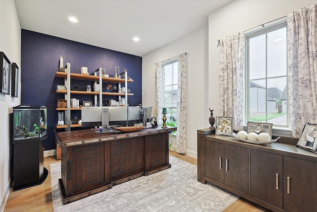 office space with light hardwood / wood-style floors