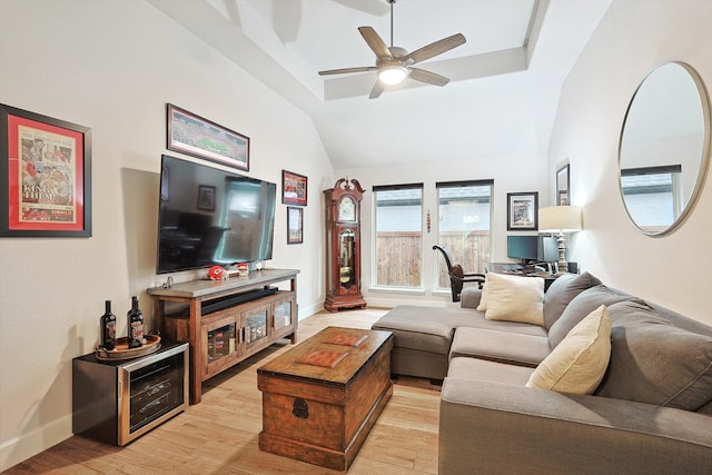 living room with high vaulted ceiling, light wood-type flooring, and ceiling fan