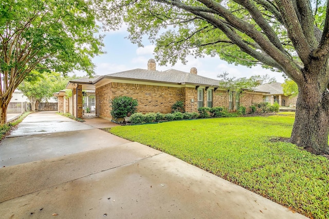 ranch-style house with a front yard