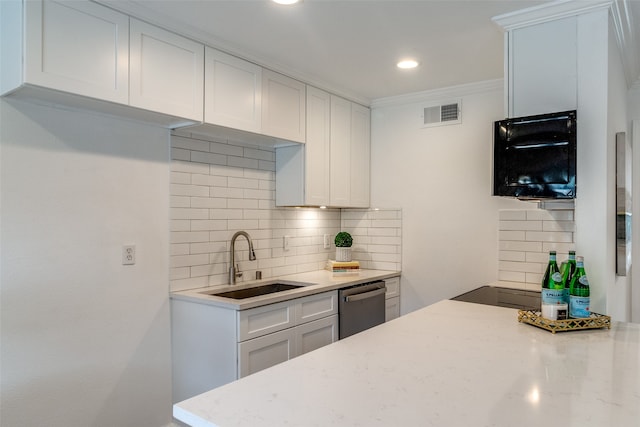 kitchen featuring decorative backsplash, crown molding, sink, dishwasher, and white cabinetry