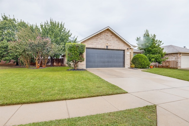 view of front of house with a garage and a front yard