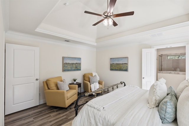 bedroom with a raised ceiling, ceiling fan, dark hardwood / wood-style flooring, and crown molding