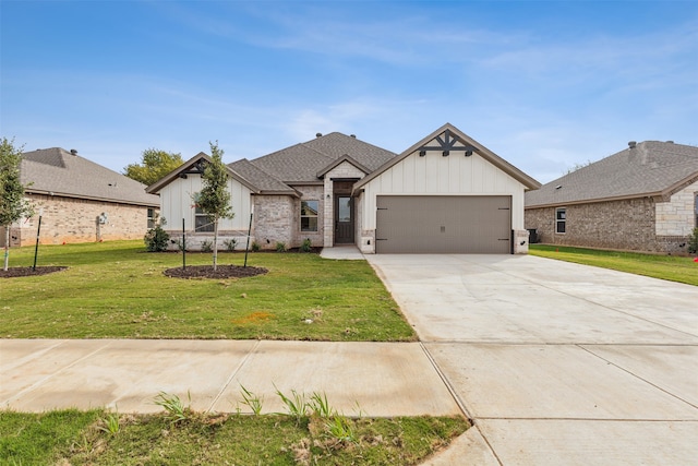 view of front of home with a garage and a front yard