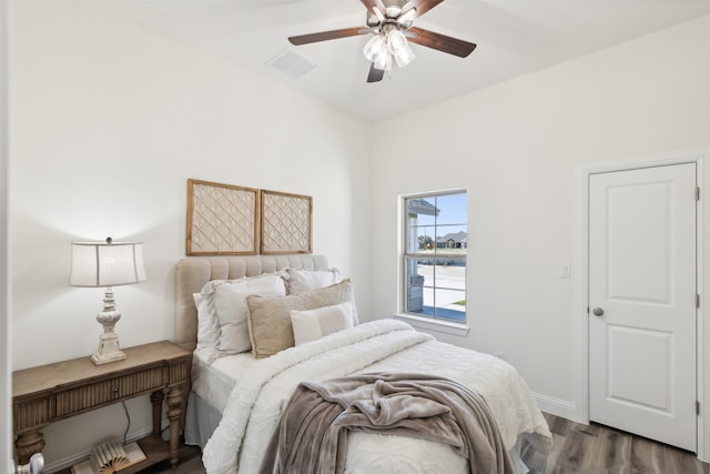 bedroom featuring hardwood / wood-style flooring and ceiling fan