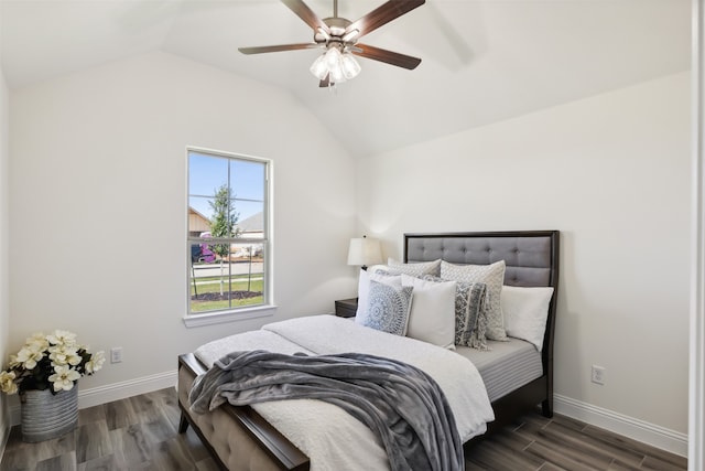 bedroom featuring vaulted ceiling, ceiling fan, and dark wood-type flooring