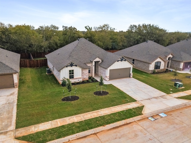 french country style house with a front lawn and cooling unit