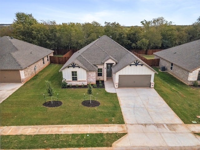 view of front of home featuring a front yard and a garage