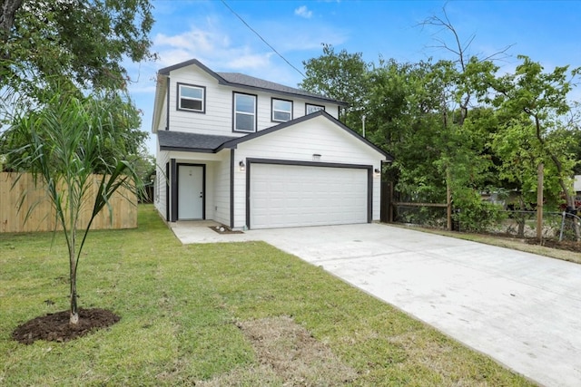 view of front facade featuring a front yard and a garage