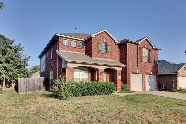 view of front of house featuring a garage and a front yard