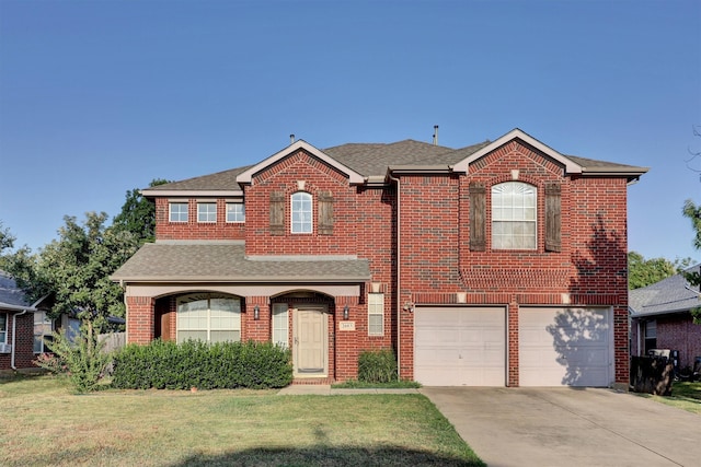 view of front facade featuring a front yard and a garage