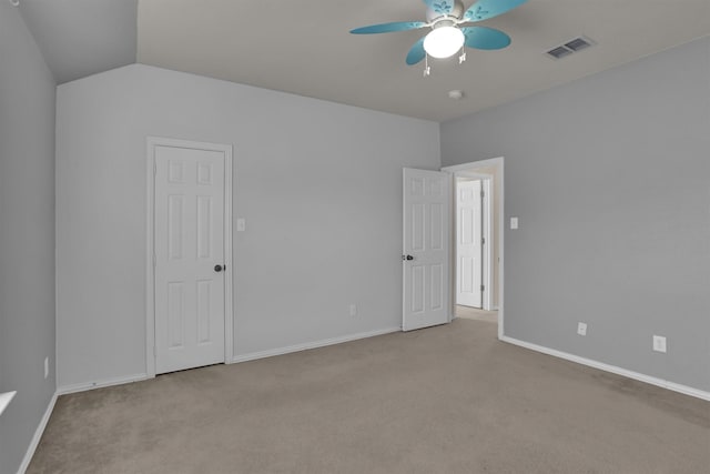 interior space featuring lofted ceiling and ceiling fan