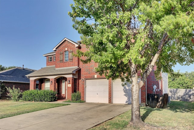 view of front of house with a garage and a front lawn