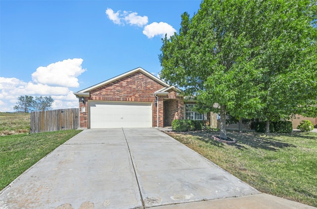 view of front of house featuring a front yard and a garage