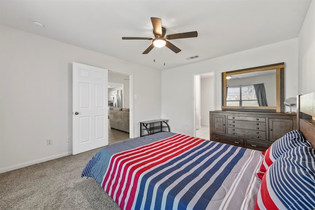 carpeted bedroom featuring ceiling fan and connected bathroom