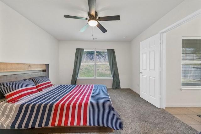 carpeted bedroom featuring ceiling fan