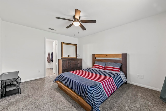 bedroom featuring carpet floors, connected bathroom, and ceiling fan