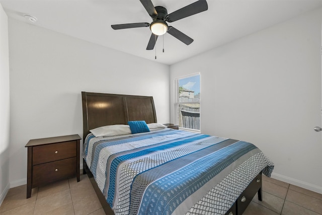 bedroom featuring ceiling fan and light tile patterned floors