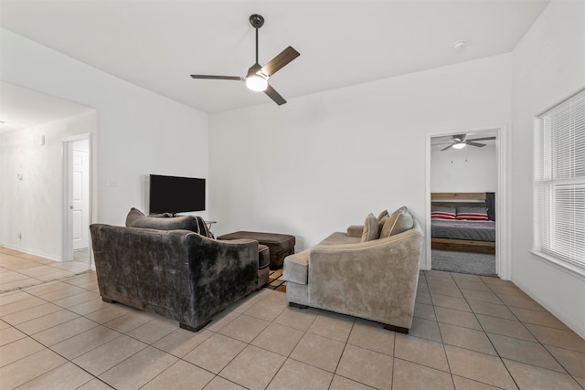 tiled living room with ceiling fan