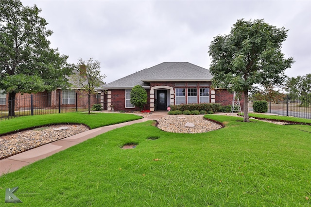 view of front of home with a front lawn