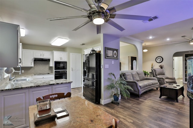 kitchen featuring white cabinetry, black appliances, kitchen peninsula, dark wood-type flooring, and ceiling fan