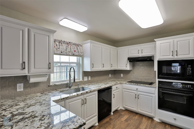 kitchen featuring black appliances, sink, white cabinets, and dark wood-type flooring