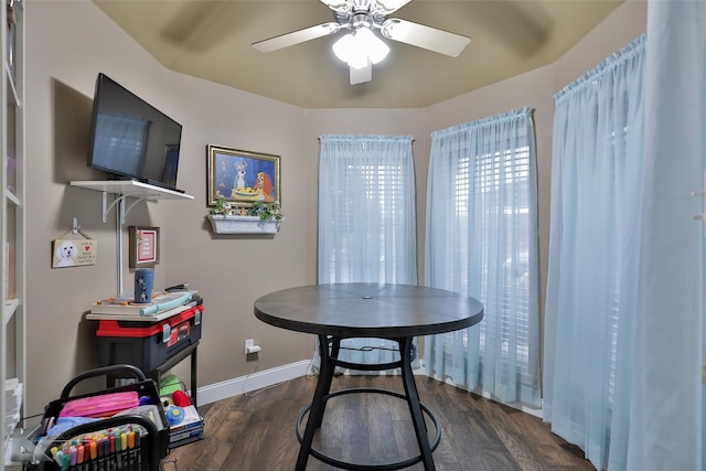 dining area featuring dark hardwood / wood-style flooring and ceiling fan