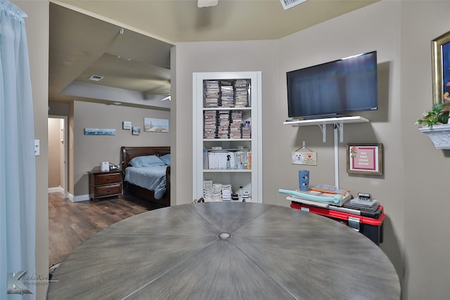 interior space featuring ceiling fan and dark hardwood / wood-style flooring