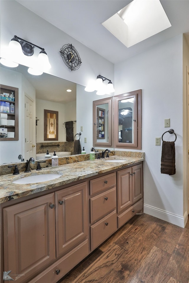 bathroom featuring vanity and wood-type flooring